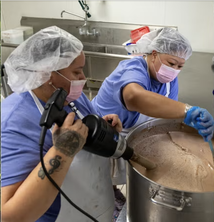 Dining services workers scooping ice cream